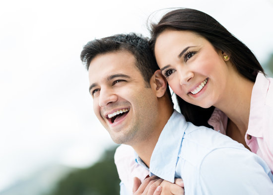 Portrait of a happy loving couple laughing outdoors