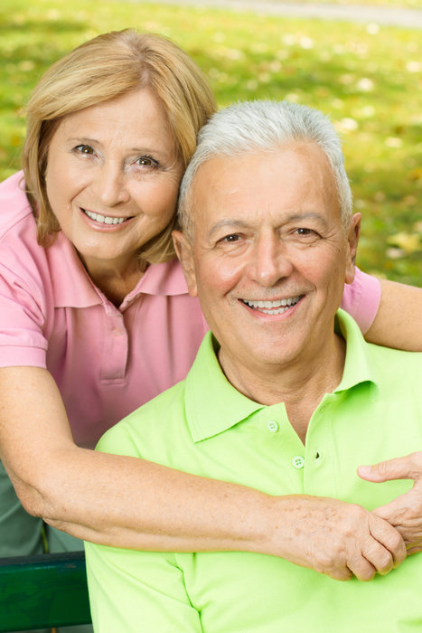 Closeup portrait of happy mature woman embracing elderly man.